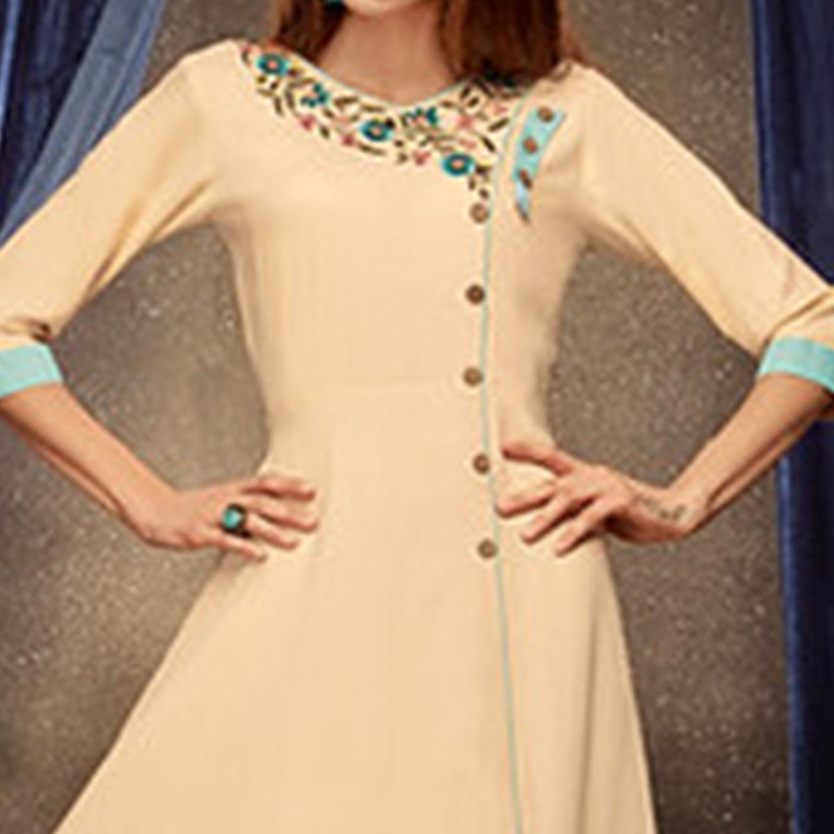 ethnic cream colored partywear embroidered rayon long kurti peachmode 2